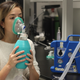 Above: Olivia Sobczyk, co-author and researcher at Toronto’s University Health Network, demonstrating how the ClearMate Device is used.